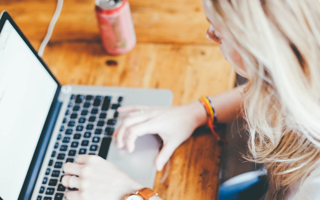 person typing on a laptop