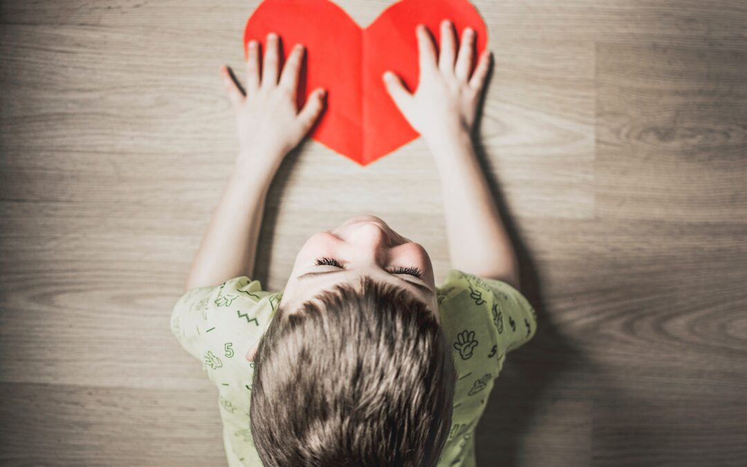 Boy with heart shaped paper